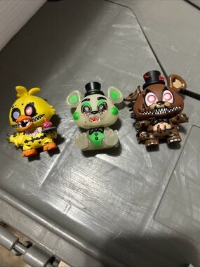 Funko Horror Plush-Style Collectible Figures in Yellow, Green, and Brown